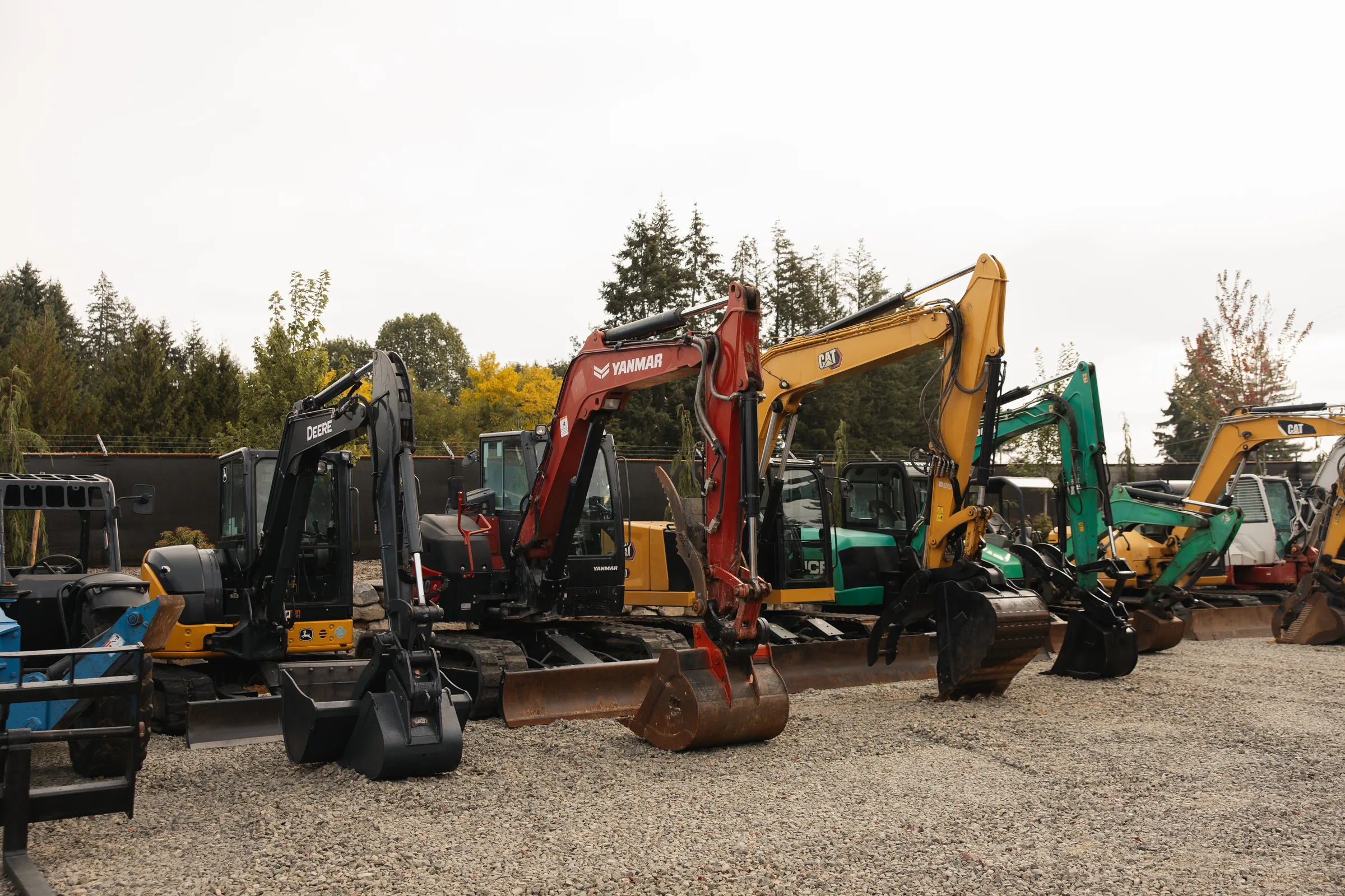 Excavators lined up at the Daily Machinery equipment yard